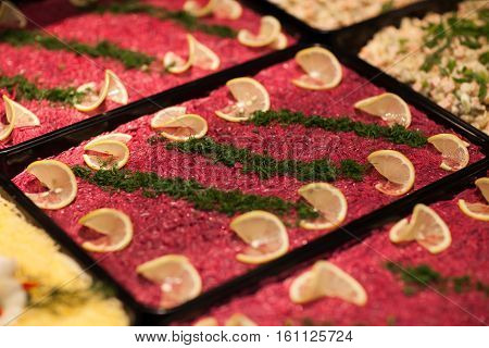 Traditional Russian salad Herring under a fur coat. Layered salad with herring and vegetables