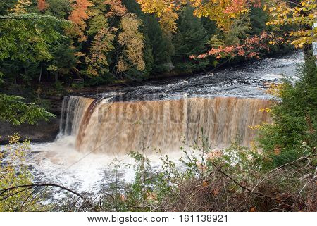 A very picturesque Upper Fall on the Tahquamenon River in framed autumn trees, Tahquamenon Falls State Park Chippewa County Michigan USA