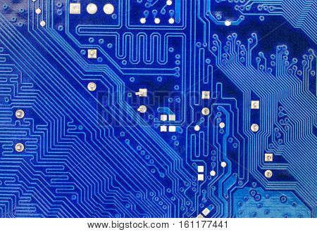 Blue computer motherboard background close up view