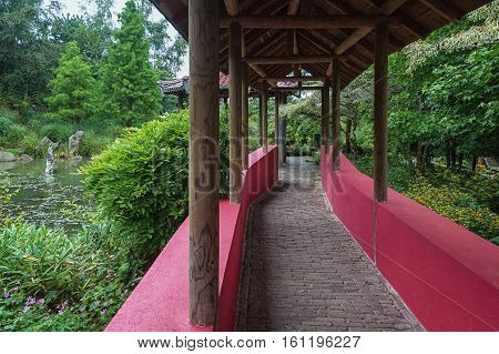 Landgraaf Netherlands - July 12 2016: Chinese garden which is crossed by a covered walkway stand with walls symbolizing the Great Wall.