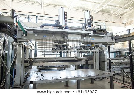 the modern powerful metal cutting laser mashine at factory. The automatic plasma robot in the course of metal cutting. Modern production of metal details.