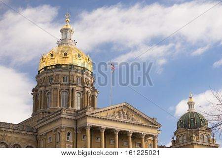 The US and State flags fly at Des Moines Capital