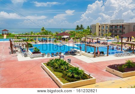 Cayo Guillermo island, Iberostar Playa Pilar hotel, Cuba, June 28, 2016, nice beautiful inviting view of big, wide open comfortable swimming pool with people relaxing and enjoying their time