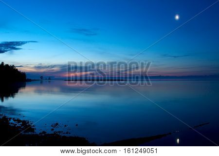 moonrise over Lake Baikal near rock Small Bell Tower, Sandy bay