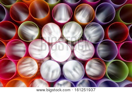 Plastic straw color. A light shone through a circular pipe. Took shape beautiful colors Take a closer focus on the details clearly.