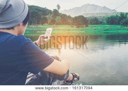 Young Man Traveler He Is Using Mobile Phone Travel Concept