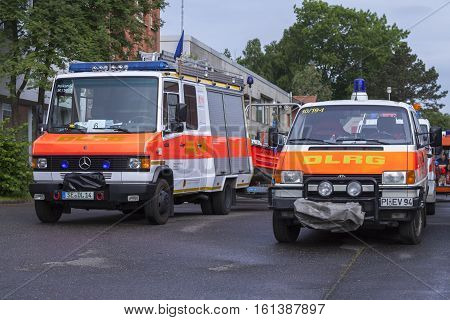 LAUENAU / GERMANY - JULY 13 2013: german DLRG ( German Lifeguard Association ) trucks stands in waiting position for the flood