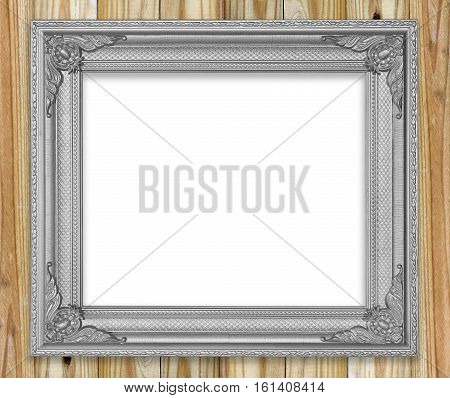 Antique gray frame on white wooden wall ;. Empty picture frame on white wooden wall.