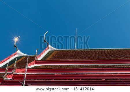 Temple Roof Vintage Thai Style With Against Blue Sky Background