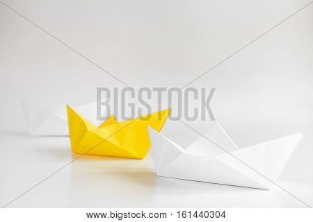 choice concept paper boats on white background close up