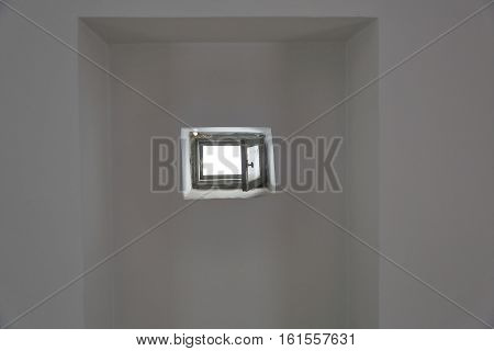 Small Window Leaf In The Wall