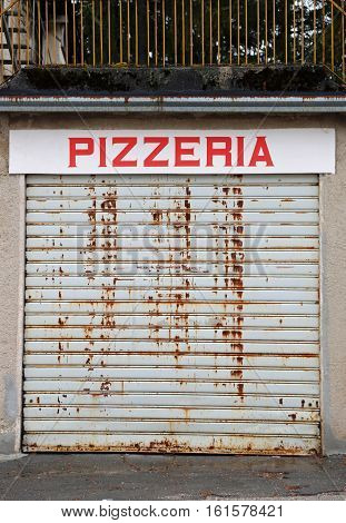 closed Italian pizzeria in the center of the big city