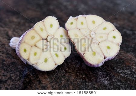ripe and healthy garlic bulb sliced in half