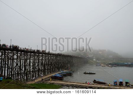 wooden Mon Bridge with fog Sangkhla BuriKanchanaburi Thailand