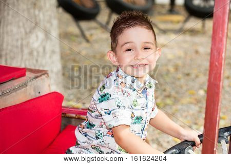 Cute little child boy in park on nature at summer. Use it for baby parenting or love conce