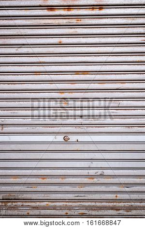 Rusty metal shutters with a small lock