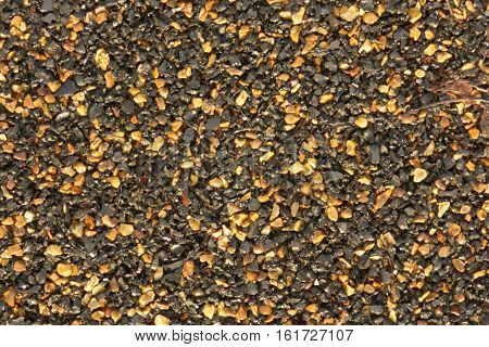 asphalt texture with black and orange grains