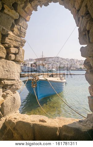 Old boat at Paros island in Greece. View from inside the Kastelli castle.
