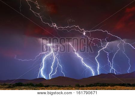 Stormy Skies with multiple lightning strikes on horizon