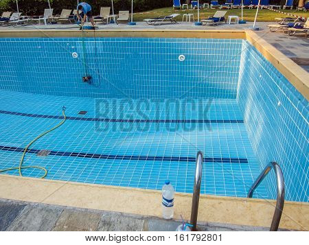 Corfu, Greece - July 12, 2011: The Hotel Staff Has Been Cleaning The Big Pool