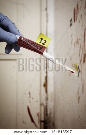 Criminologist technician with DNA collect swab in hand