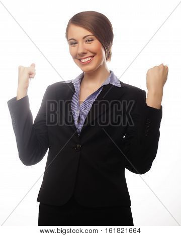 Winner business woman with her hands raised isolated on white