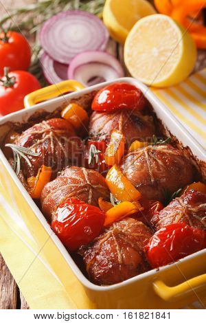 Tasty Rabbit Fillet Baked With Tomatoes, Pepper And Rosemary Close Up. Vertical