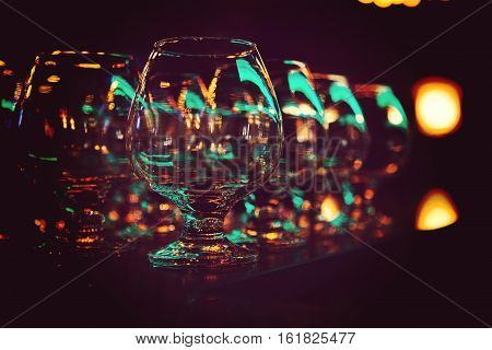 Glasses for alcohol. Glasses on a bar at the restaurant