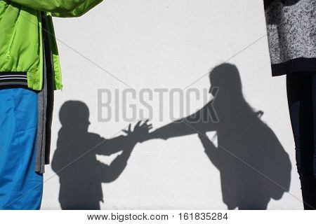 children playing reflected shadow on the background wall