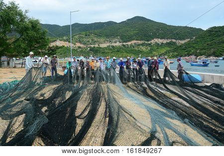 Many Fishermen Working With Fishing Nets