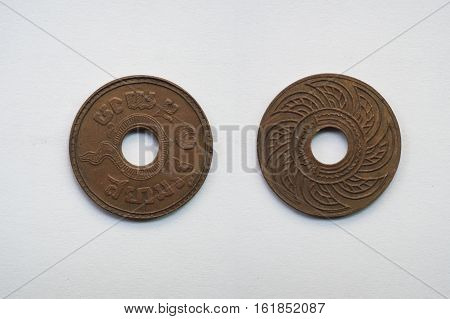 Old coin Thailand which is obsolete today on white background 1 baht