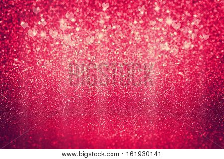 Valentine's day glitter red background hearts and stars toned image selective focus