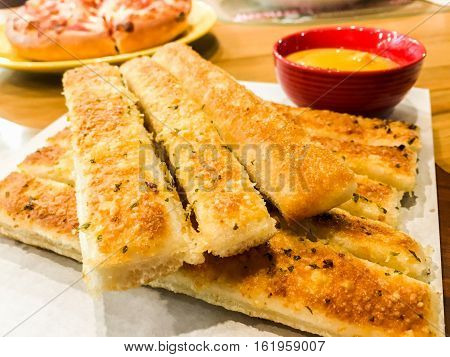 Homemade Cheesy Breadsticks with Marinara Sauce for Dipping