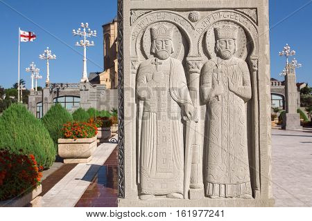 TBILISI, GEORGIA - SEP 27, 2016: Two saints seniors on relief of stone column near Holy Trinity Cathedral on September 27, 2016. The Orthodox cathedral was built in 2004 with 9 chapels and narthex