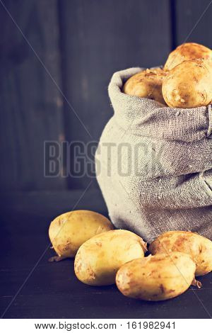 new potatoes on a dark RUSTIC background.