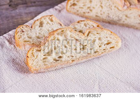 ciabatta fresh bread fresh ciabatta on the table. Italian ciabatta bread cut in slices.