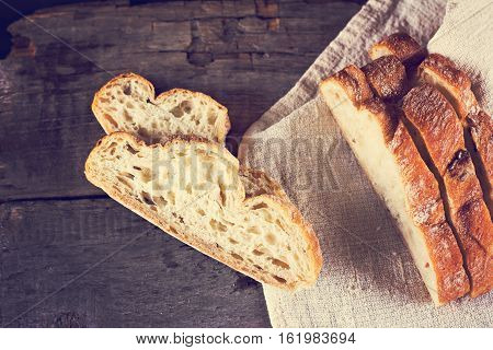 ciabatta fresh bread fresh ciabatta on the table. Italian ciabatta bread cut in slices.
