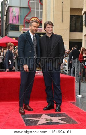 LOS ANGELES - DEC 15:  Ryan Reynolds, Nathan Fillion at the Ryan Reynolds Hollywood Walk of Fame at tbe Hollywood & Highland on December 15, 2016 in Los Angeles, CA