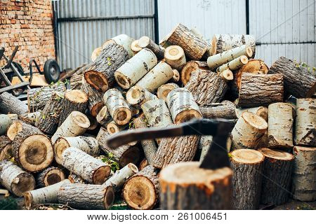A Sharp Blade Of An Ax That Sticks Out In A Wooden Chock. Rustic Concept