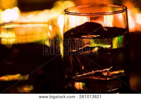 Colored Lighting Of Glasses In The Night Club Bar