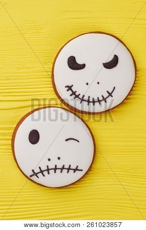 Halloween Gingerbread Cookies On Yellow Background. Jack Skellington Sugar Cookies. White Halloween 