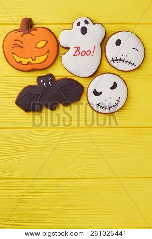 Halloween Cookies On Color Background. Top View On Various Halloween Gingerbread Biscuits Including 