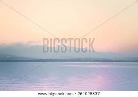 A Dreamy, Hazy Landscape Of A Mountains Close To Sunset. Sun Flase And Misty Look In Blue Tones. Mo