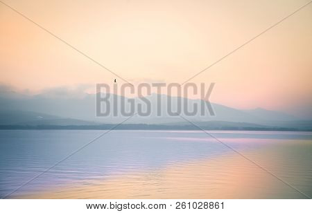 A Dreamy, Hazy Landscape Of A Mountains Close To Sunset. Sun Flase And Misty Look In Blue Tones. Mo