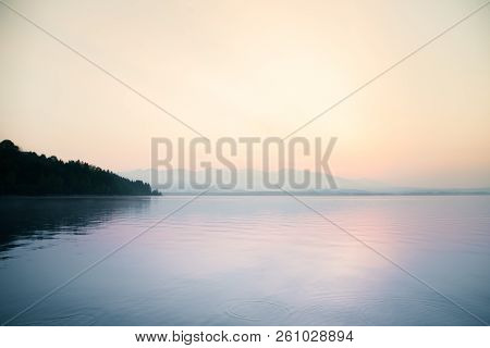 A Dreamy, Hazy Landscape Of A Mountains Close To Sunset. Sun Flase And Misty Look In Blue Tones. Mo