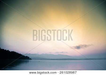 A Dreamy, Hazy Landscape Of A Mountains Close To Sunset. Sun Flase And Misty Look In Blue Tones. Mo
