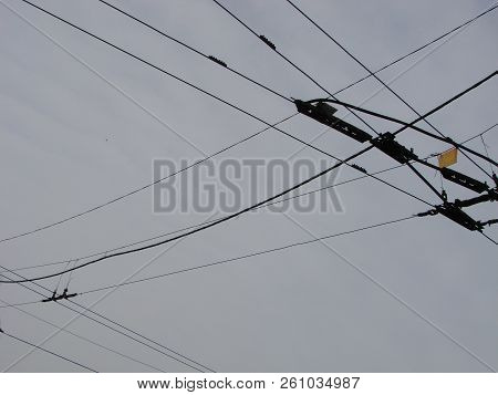 Wires Pole With Blue Sky. Electrical Wires On A Background. Electric Cables. Power Cable With Blue S