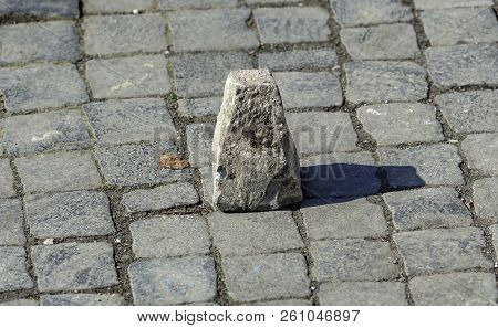Typical Pavement Of The Streets Of Rome With Cobblestone (sanpietrini). In View Of One Of The Stone 