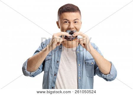 Teenage boy eating a chocolate donut isolated on white background