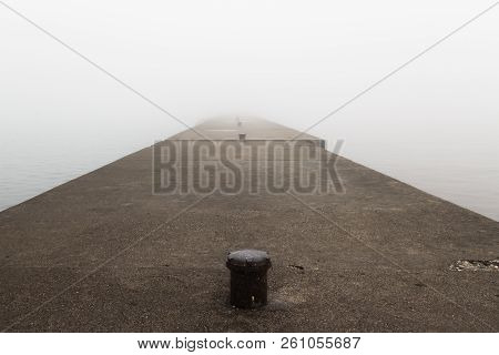 A Pier On Lake Michigan Obscured By Thick Fog.  Sheboygan, Wisconsin, Usa.